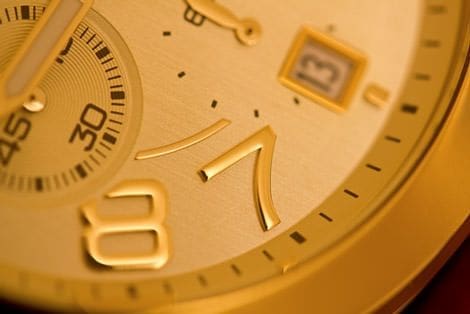 A watch dial with a coating of precious metal.